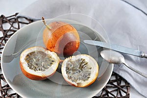 Granadilla or grenadia passionfruit on blue