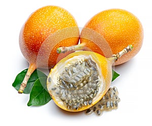 Granadilla with leaves and passion fruit half isolated on a white background