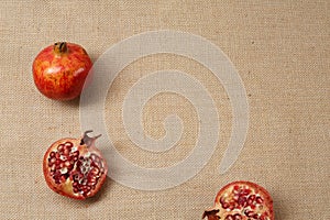 Granat Apple lying on a sackcloth surface