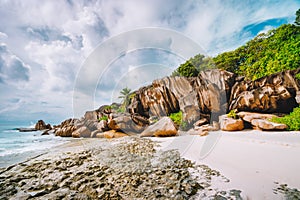 Grand Anse beach at La Digue island in Seychelles. Most famous granite rocks, white sandy beach, ocean lagoon and white