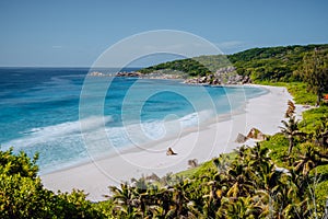 Grand Anse beach at La Digue island in Seychelles from view point above. White sandy beach with blue ocean lagoon and