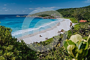 Grand Anse beach at La Digue island in Seychelles from view point above. White sandy beach with blue ocean lagoon and