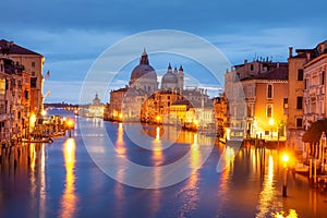 Grand Canal and Basilica Santa Maria della Salute, Venice, Italy. Amazing view on Venice Grand Canal illuminated by city lights.