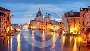 Grand Canal at night, Venice. Santa Maria della Salute church at night city lights, Italy. Venice cityscape illuminated by city