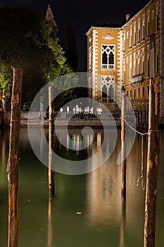 Grand Canal in Venice, Italy at night, glimpse of Palazzo Franchetti