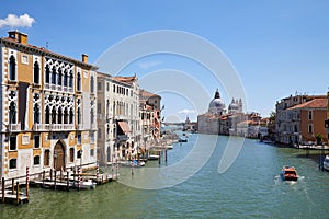 Grand Canal in Venice at midday with Saint Mary of Health basilica in Italy