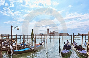 Grand canal in Venice, Piazza San Marco, in the background the island San Giorgio. Scenic moody cityscape with gondolas