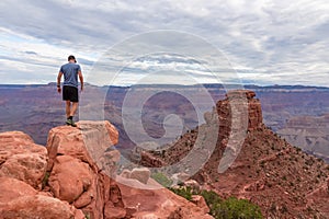 Grand Canyon - Man with panoramic aerial view from Skeleton Point on South Kaibab hiking trail at South Rim, Arizona, USA