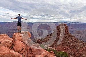 Grand Canyon - Man with panoramic aerial view from Skeleton Point on South Kaibab hiking trail at South Rim, Arizona, USA