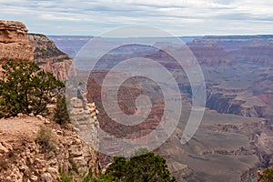 Grand Canyon - Man with panoramic aerial view from Skeleton Point on South Kaibab hiking trail at South Rim, Arizona, USA