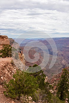 Grand Canyon - Man with panoramic aerial view from Skeleton Point on South Kaibab hiking trail at South Rim, Arizona, USA