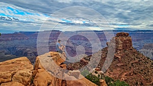 Grand Canyon - Man with panoramic aerial view from Skeleton Point on South Kaibab hiking trail at South Rim, Arizona, USA