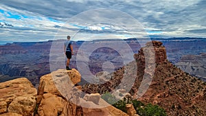 Grand Canyon - Man with panoramic aerial view from Skeleton Point on South Kaibab hiking trail at South Rim, Arizona, USA