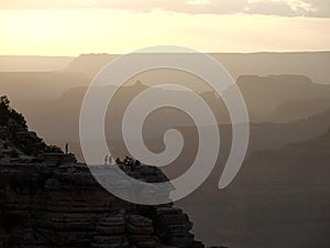 Grand canyon sunset with people on the rocks - USA