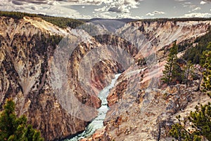 Grand Canyon of Yellowstone, the river flows through the cliffs of yellow and orange sandstone, in Yellowstone National Park,