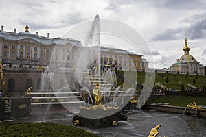 The Grand Cascade and Samson Fountain golden sculpture of Samson tearing open the jaws of a lion with the palace in the back