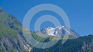 Grand Casse and surrounding mountains with pine forest , France