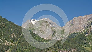 Grand Casse and surrounding mountains with pine forest , France