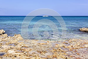 Grand Cayman Island Shore And A Motorboat