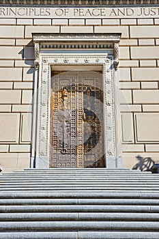 Grand Entrance with Golden Door and Principles Inscription, Low Angle