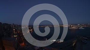 the Grand Harbor bay at sunset in Valletta, Malta