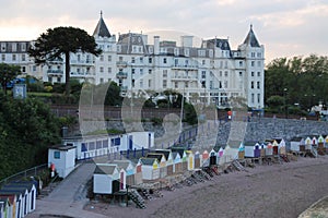 The Grand Hotel and beach huts in different colours in the city Torquay.