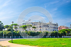 Grand Hotel and square with green lawn in touristic city centre Rimini