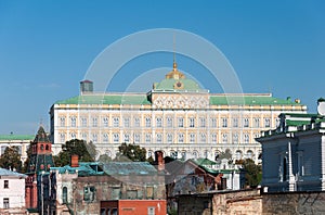 Grand Kremlin Palace on the background of old ruined houses.