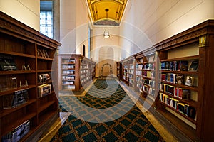 Grand Library Interior with Ornate Bookshelves and Ceiling