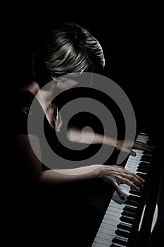 Grand piano player. Pianist playing piano concert photo
