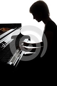 Grand piano player. Pianist woman playing piano