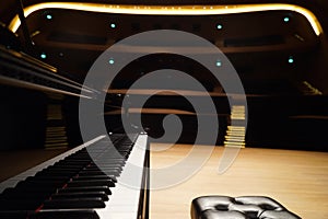 Grand Piano and seat in Concert Hall, close-up