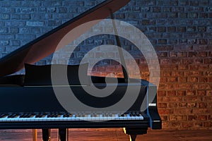 Grand Piano on the stage of concert hall or small jazz club