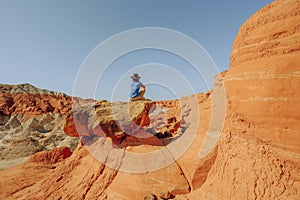 Grand Staircase-Escalante national monumen, Utah. Toadstools, an amazing balanced rock formations and silhouette of woman enjoying