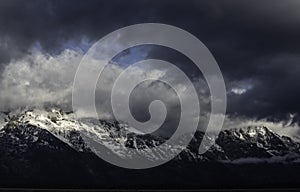 The Grand Teton Mountains covered with snow.