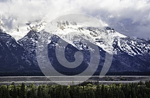 The Grand Teton Mountains covered with snow.