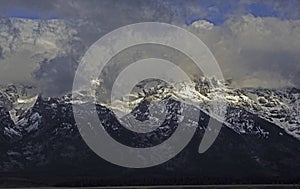 The Grand Teton Mountains covered with snow.