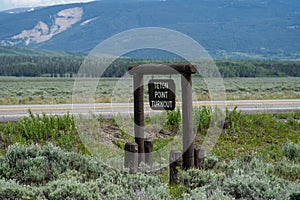 The Grand Teton National Park mountains in Wyoming - the Teton Point turnout sign