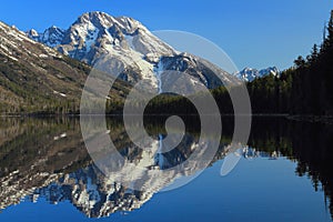 Grand Teton National Park, Rocky Mountains with Mount Moran reflected in Jenny Lake, Wyoming, USA