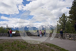 Grand Teton national Park at the Snake River overlook viewing point, with some tourists taking photographs