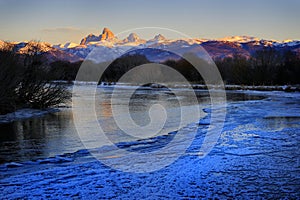 Grand Tetons Mountain Range Teton Mountains with Snow and Sunset Light with River & Ice