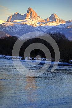 Grand Tetons Mountain Range Teton Mountains with Snow and Sunset Light with River & Ice