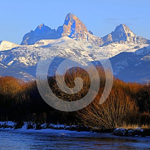 Grand Tetons Mountain Range Teton Mountains with Snow and Sunset Light with River & Ice