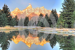 Grand Tetons sunrise over frozen lake - Schwabachers Landing , S