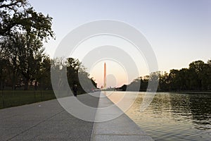 Grand view eastwards along the National Mall`s tree-lined boulevard towards America`s national monument, the Washington Monument