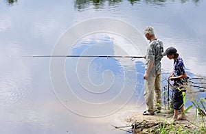 Grandad and grandson fishing photo