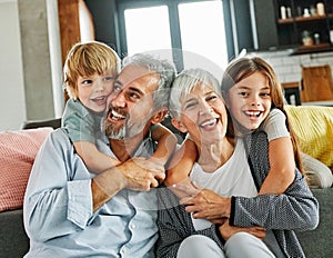 grandchild family child grandparent man woman grandfather happy together grandmother girl senior boy smiling