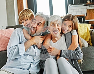 grandchild family child grandparent man woman grandfather happy together grandmother girl senior boy smiling