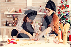 Grandchild using dough shape cutter on christmas day