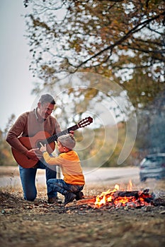 Granddad with grandson with guitar